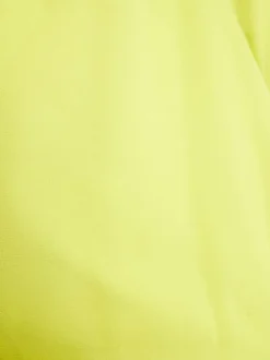 Top anis à encolure américaine avec une coupe péplum et col cache-coeur
