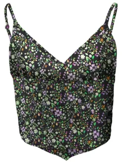 Top asymétrique noir fleuri avec une coupe cropped et un col v