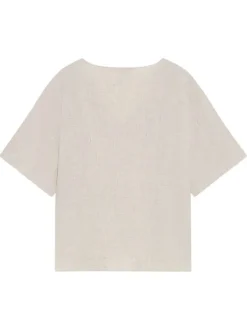 Top beige uni fluide avec une coupe large et des manches courtes
