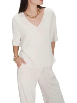 Top beige uni fluide avec une coupe large et des manches courtes