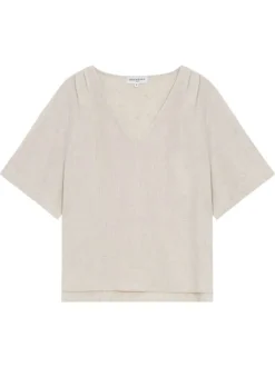 Top beige uni fluide avec une coupe large et des manches courtes