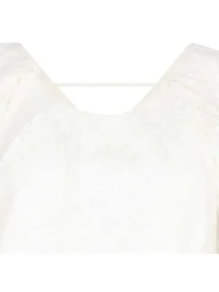 Top blanc uni en dentelle avec une coupe droite et un col rond
