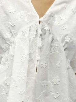 Top en coton blanc uni pourvu d'un col v et d'une coupe droite