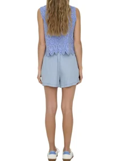 Top en coton bleu uni avec une coupe droite et un col rond