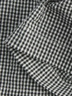 Top en coton noir pourvu d'un motif à carreaux et d'un décolleté bustier