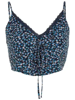 Top à fines bretelles marine fleuri avec une coupe cropped et un col v