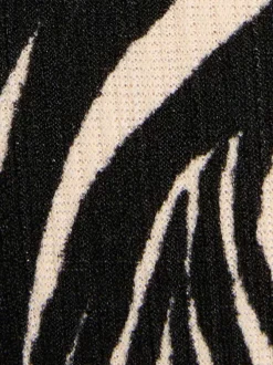 Top noir et blanc zébré à coupe ajustée avec col v et manches longues
