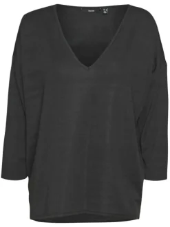 Top noir pailleté avec une coupe droite un col v et des manches longues