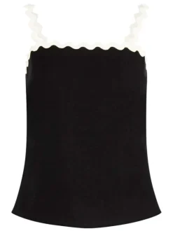 Top noir uni pourvu d'une coupe ajustée et de finitions festonnées contrastées