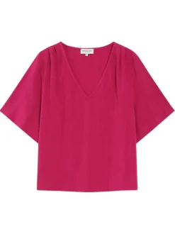 Top rose uni fluide avec une coupe large et des manches courtes