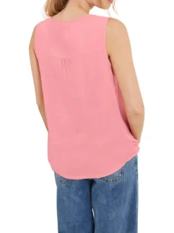 Top rose uni sans manches avec une matière fluide et un col fendu