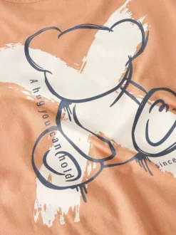 T-shirt en coton biologique peche uni pourvu d'un imprimé ours