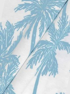 T-shirt en coton blanc à imprimé grands palmiers avec un col rond