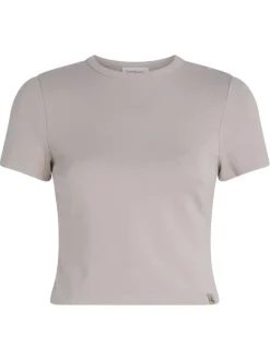 T-shirt beige uni avec une coupe crop top près du corps et un col rond