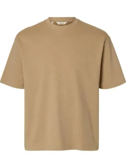 T-shirt beige uni coupe ample avec un col rond et des manches courtes