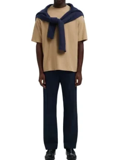 T-shirt beige uni coupe ample avec un col rond et des manches courtes