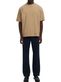 T-shirt beige uni coupe ample avec un col rond et des manches courtes