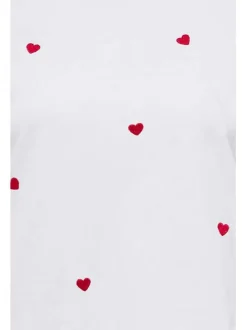 T-shirt blanc en coton avec des cœurs rouges brodés et un col rond