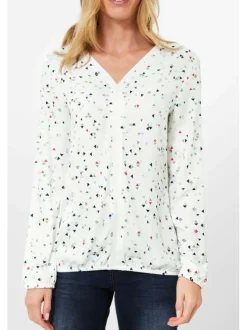 T-shirt blanc fleuri avec une coupe droite col rond et à manches courtes