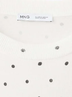 T-shirt blanc à motifs pourvu de manches courtes et d'un col rond