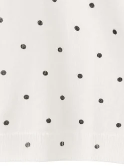 T-shirt blanc à motifs pourvu de manches courtes et d'un col rond
