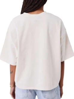 T-shirt écru pourvu d'un col rond finement côtelé et de manches courtes