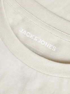 T-shirt en coton beige imprimé floral avec une coupe ample et col rond