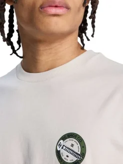 T-shirt en coton beige uni avec une coupe droite et un col rond