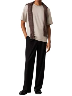 T-shirt en coton beige uni avec une coupe oversize et un col rond