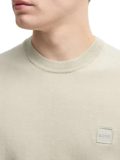 T-shirt en coton beige uni en maille avec une coupe oversize et un col rond