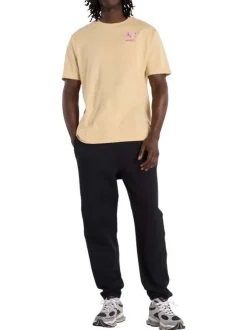 T-shirt en coton beige uni pourvu d'un col rond et de manches courtes
