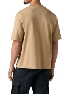 T-shirt en coton beige uni pourvu d'un col rond et de manches courtes