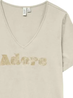 T-shirt en coton biologique écru avec inscription "Adore" en paillettes dorées