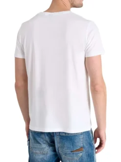 T-shirt en coton blanc imprimé à la poitrine avec un col rond
