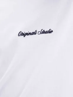 T-shirt en coton blanc uni avec une coupe droite et un col rond