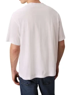 T-shirt en coton blanc uni coupe ajustée col rond avec un logo blanc