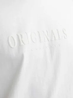 T-shirt en coton blanc uni à coupe droite avec écriture en relief