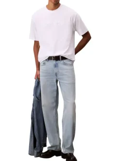 T-shirt en coton blanc uni à coupe oversize avec le nom de la marque brodé
