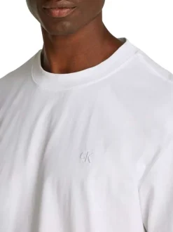 T-shirt en coton blanc uni à coupe oversize avec un imprimé logo à l'arrière