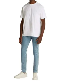 T-shirt en coton blanc uni à coupe oversize avec un imprimé logo à l'arrière