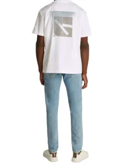 T-shirt en coton blanc uni à coupe oversize avec un imprimé logo à l'arrière