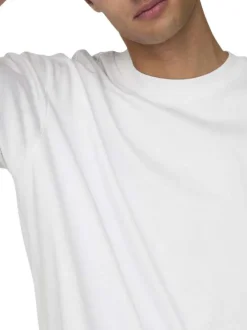 T-shirt en coton blanc uni épais avec une coupe très oversize et un col rond