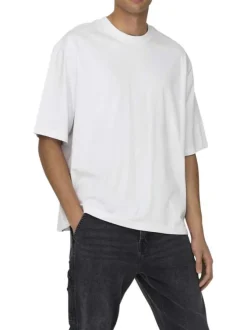 T-shirt en coton blanc uni épais avec une coupe très oversize et un col rond
