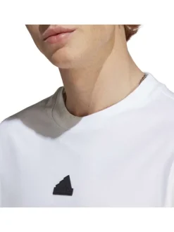 T-shirt en coton blanc uni une coupe droite et un logo poitrine en contraste