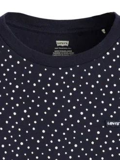 T-shirt en coton bleu marine à pois avec une coupe près du corps et un col rond