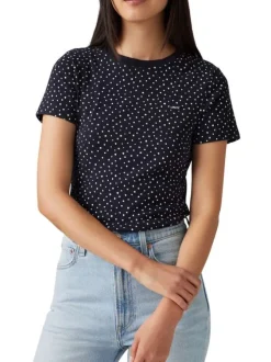 T-shirt en coton bleu marine à pois avec une coupe près du corps et un col rond