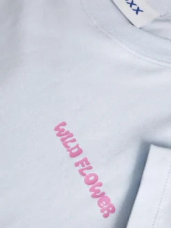 T-shirt en coton bleu à motifs imprimés pourvu d'une coupe droite
