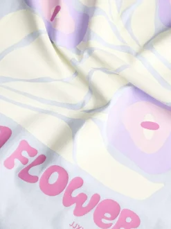 T-shirt en coton bleu à motifs imprimés pourvu d'une coupe droite