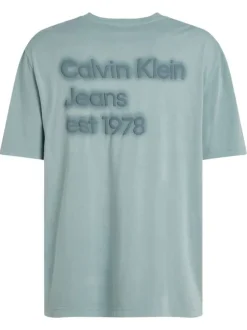 T-shirt en coton bleu uni à coupe oversize avec une écriture gaufrée à l'arrière
