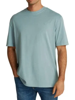 T-shirt en coton bleu uni à coupe oversize avec une écriture gaufrée à l'arrière